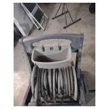 Plastic roll away garden hose