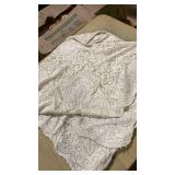 Cream colored small lace tablecloth