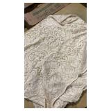 Cream colored small lace tablecloth