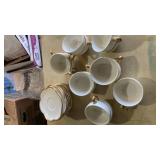 9) saucers 13) cupsWhite Porcelain Tea Cups with Gold Trim