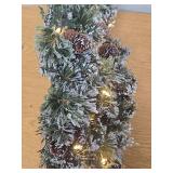 National Tree Company Pre-Lit Artificial Christmas Garland  Green  Glittery Bristle Pine  White Lights  Decorated with Pine Cones  Battery Operated  Christmas Collection  9 Feet