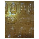 Cake Decorating Items and Candy Molds in a Basket