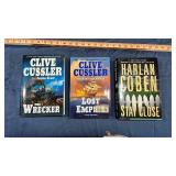 Clive Cussler hardcover books 2, and 1 hard cover book by Harlan Coben