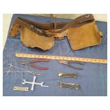 Leather tool bag some hand tools
