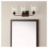 Hampton Bay Evangeline 23 in. 3-Light Modern Bronze Farmhouse Bathroom Vanity Light with Clear Seeded Glass Shades