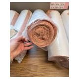 5 rolls of 22 in fiberglass insulation with plastic backing and clips