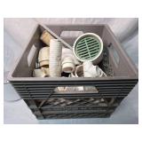 Crate full of plumbing items