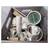 Crate full of plumbing items