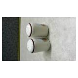 White Ceramic Salt and Pepper Shakers with Wolf and Pine Tree Design