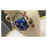 Decorated Ceramic Vase with Blue Shield Design