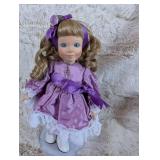 Collectible Porcelain Doll in Purple Dress