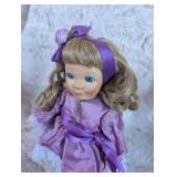 Collectible Porcelain Doll in Purple Dress