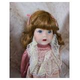 Elegant Porcelain Doll in Pink Satin and Lace