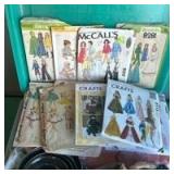 McCalls Sewing Patterns with Scrap Fabric and Misc Sewing Supplies in Storage Container
