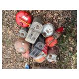 Pile of metal gas cans -- BY