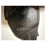 BASKET WITH ONE (1)  HOLSTER & TWO (2) PISTOL CASES