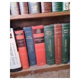 Wooden Bookshelf With MIsc Law & Health Books.