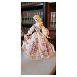Vintage Lefton porcelain figurine of a woman in a large dress with red flowers