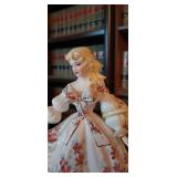 Vintage Lefton porcelain figurine of a woman in a large dress with red flowers
