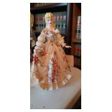 Vintage Lefton porcelain figurine of a woman in a large dress with red flowers