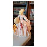 Vintage Lefton porcelain figurine of a woman in a large dress with red flowers