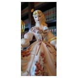 Vintage Lefton porcelain figurine of a woman in a large dress with red flowers