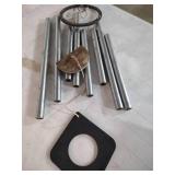 Large Metal Wind Chimes with Wooden Striker has one chime loose