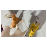 Assorted plastic animals, horses, and cows