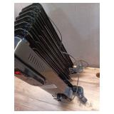 1500-Watt Black Indoor Electric Oil-Filled Radiator Convection Radiant Space Heater with Remote Control for Living Space (Missing one Wheel) - Retail: $65