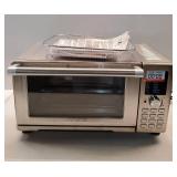 Nuwave Bravo Pro XL Convection Oven and Air Fryer with Probe. MISSING SHELVES. DENTED Inside Top Left Corner.  Door Seems to Shut Correctly. See Last Two Photos. - Retail: $249