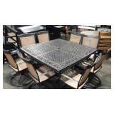 Hanover Fontana 9-Piece Bronze Patio Dining Set Aluminum Square Table with 8 Tan Swivel Rocker Chairs - Retail: $2,999