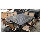 Hanover Fontana 9-Piece Bronze Patio Dining Set Aluminum Square Table with 8 Tan Swivel Rocker Chairs - Retail: $2,999