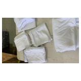 One full size flat sheet and four misc standard pillow cases.