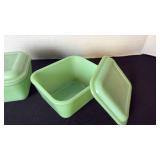 Fire King Jadeite refrigerator dishes with lids.