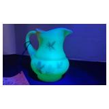 Fenton UV reactive painted pitcher with a Burmese treatment