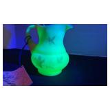 Fenton UV reactive painted pitcher with a Burmese treatment