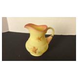 Fenton UV reactive painted pitcher with a Burmese treatment