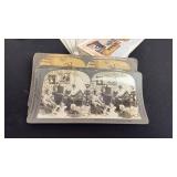 Antique hand-held wooden stereoscope viewer with picture cards