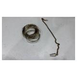 Lapel clasp and stack of bangles