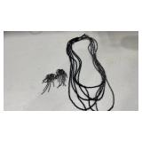 Womens necklace and pair of earrings