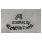 Womens bracelets and pair of earrings
