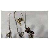 Womens necklaces and a flag pin