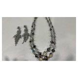 Womens necklace and pair of earrings