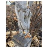 Concrete garden statue depicting the Roman god Bacchus on concrete base approximately 88 x 18 x 18 in VERY HEAVY will need help and equipment to remove. Easy alley to backyard access.