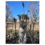 Concrete garden statue of a woman, often referred to as a harvest or autumn statue. Approximately 88 x 18 x 18 in VERY HEAVY will need help and equipment to remove. Easy alley to backyard access.