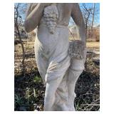 Concrete garden statue of a woman, often referred to as a harvest or autumn statue. Approximately 88 x 18 x 18 in VERY HEAVY will need help and equipment to remove. Easy alley to backyard access.