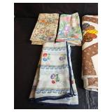 Mixed Lot of Decorative Cloth Napkins and Vinyl Tablecloths