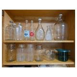 Contents of Cabinet- Quart Canning Jars, Unique Bottles, Dishes, Corn Cob Holders, Spice Tins, and Toaster