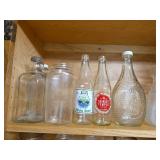 Contents of Cabinet- Quart Canning Jars, Unique Bottles, Dishes, Corn Cob Holders, Spice Tins, and Toaster