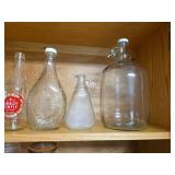 Contents of Cabinet- Quart Canning Jars, Unique Bottles, Dishes, Corn Cob Holders, Spice Tins, and Toaster